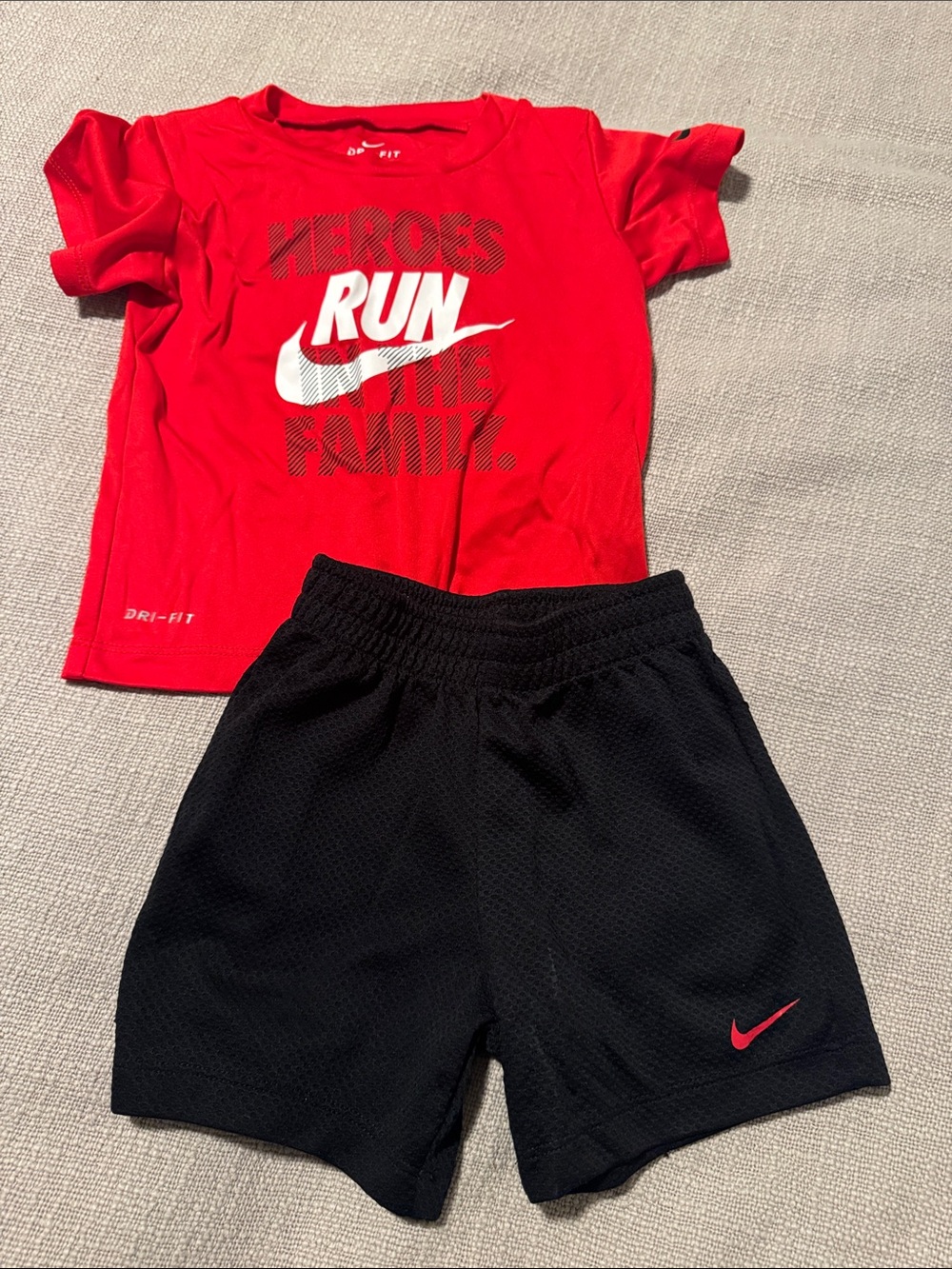 Nike Kids Black Athletic Shorts with Red Swoosh